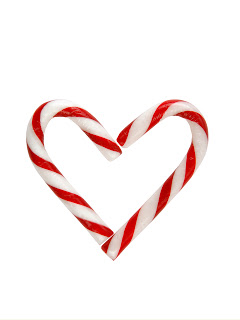 Two candy canes on white background